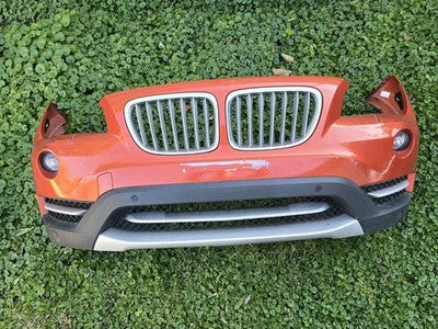 2012 2013 2014 2015 BMW X1 FRONT BUMPER COVER ORANGE COMPLETE OEM
