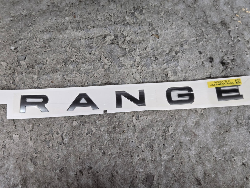 RANGE ROVER TRUNK BADGE EMBLEM OEM JK62-407A74-CA "RANGE" ONLY NEW