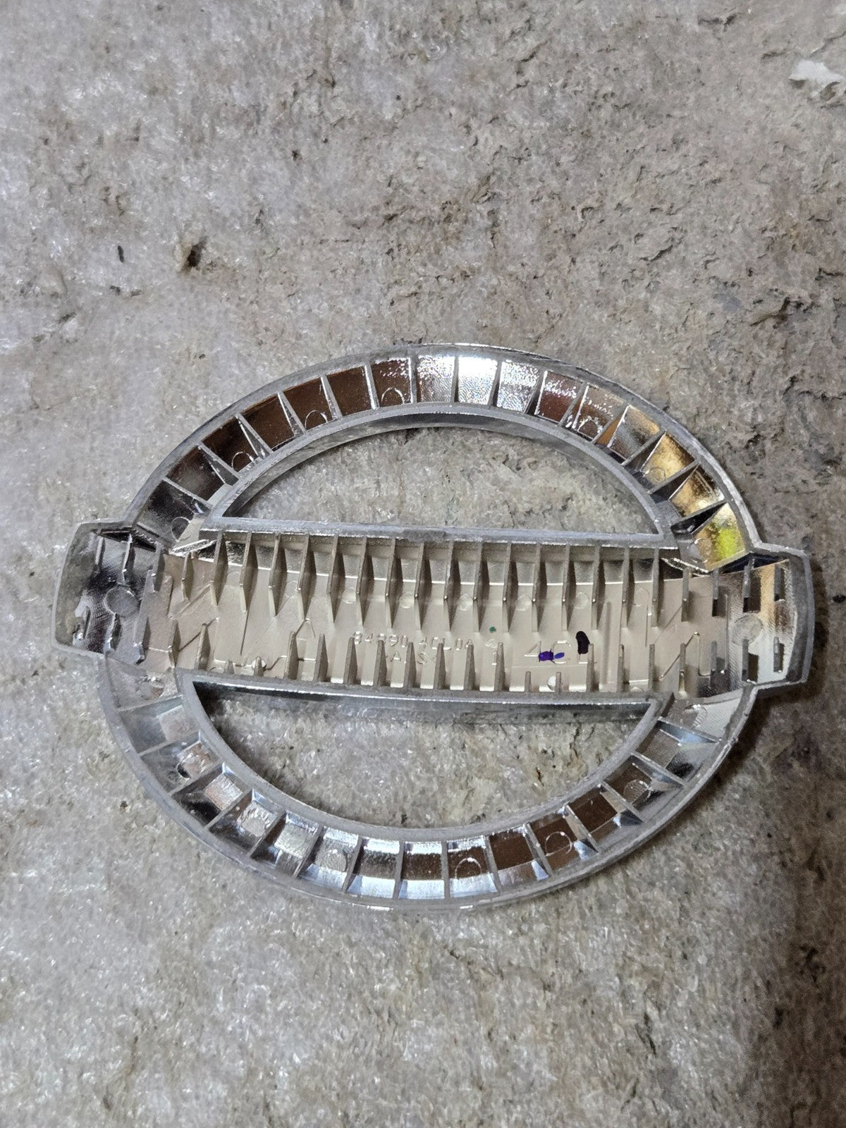 Genuine Nissan Emblem 84890-4CL0A USED OEM