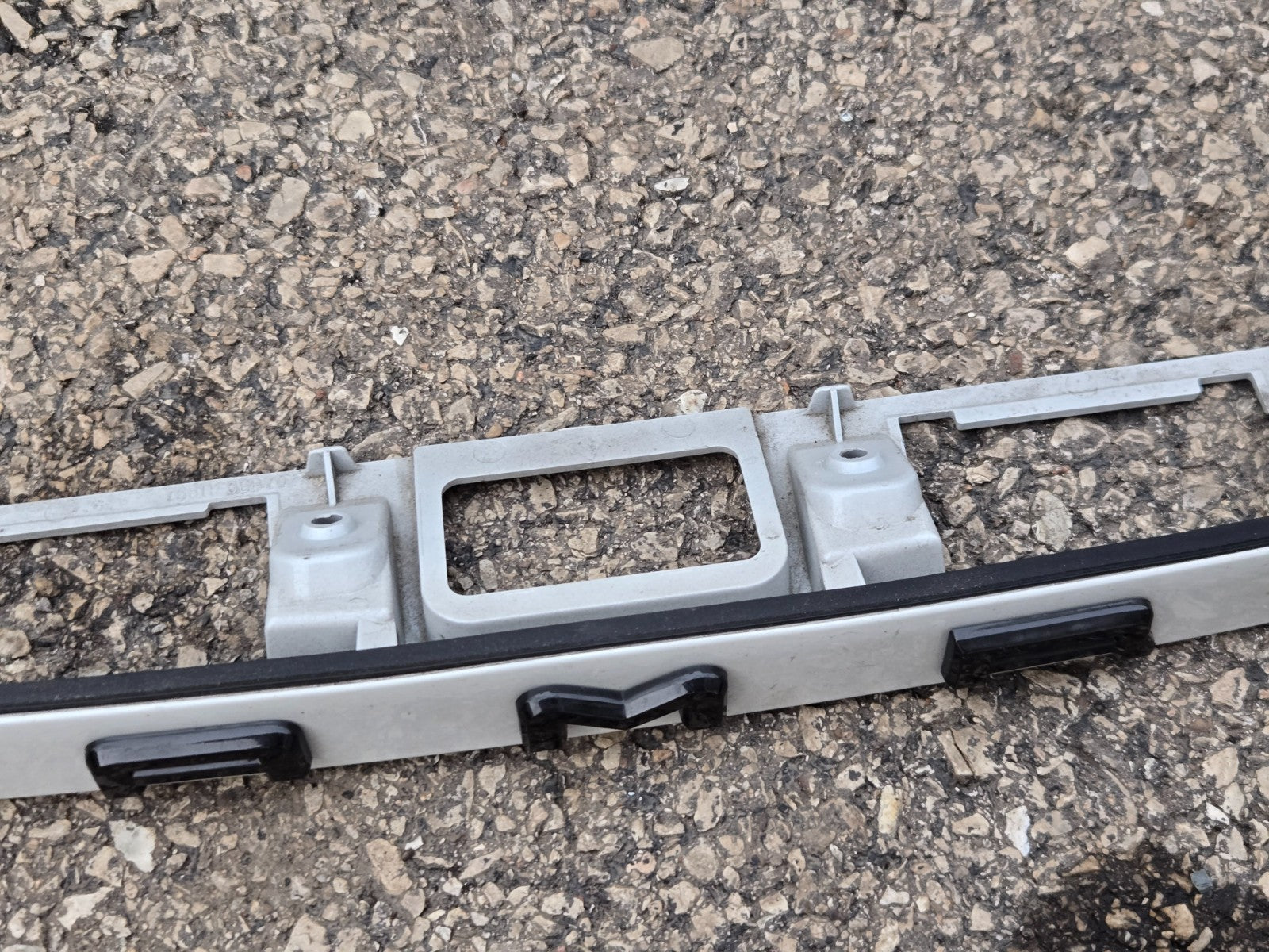 2021-24 TOYOTA CAMRY REAR TRUNK LID LICENSE PLATE MOLDING WHITE OEM 76811-06B70